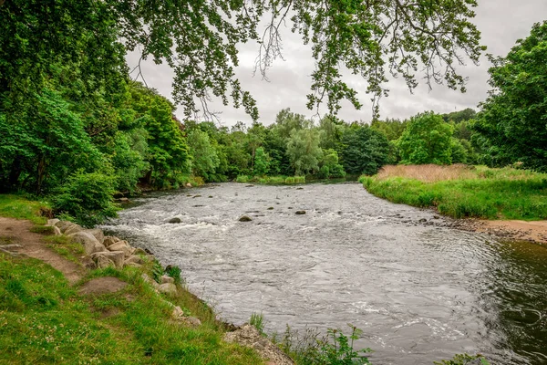A view of River Don flowing in Seaton park in summer time, Aberdeen