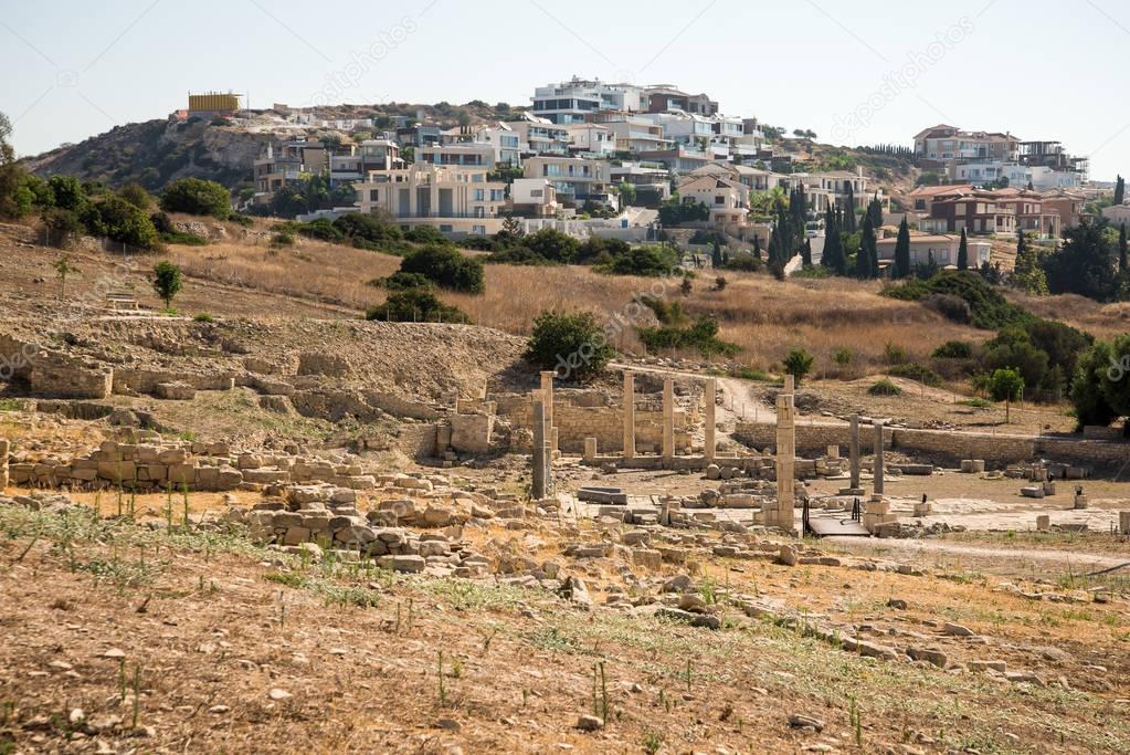 Ruins of Amathus ancient city with modern residential houses in background, Limassol