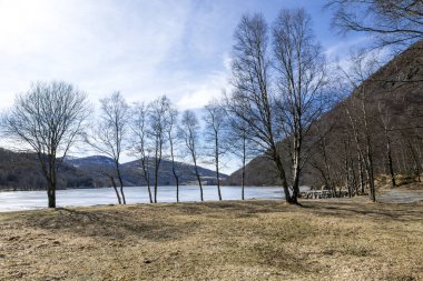 A view of the frozen Tengesdalsvatnet lake from tourists and visitors car park in winter season, Sandnes commune, Norway, March 2018 clipart