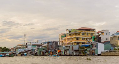 Riverside stilt houses in the Mekong Delta clipart