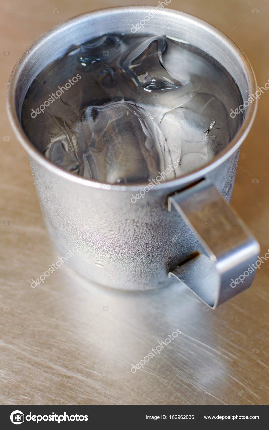 Metal Glass Or Cup Of Cold Water With Ice On Stainless Steel Table Background Royalty Free Photo Stock Image By C Rostovdriver Metal Glass Or Cup Of Cold Water With Ice On Stainless Steel Table Background Royalty Free Photo Stock Image By C Rostovdriver