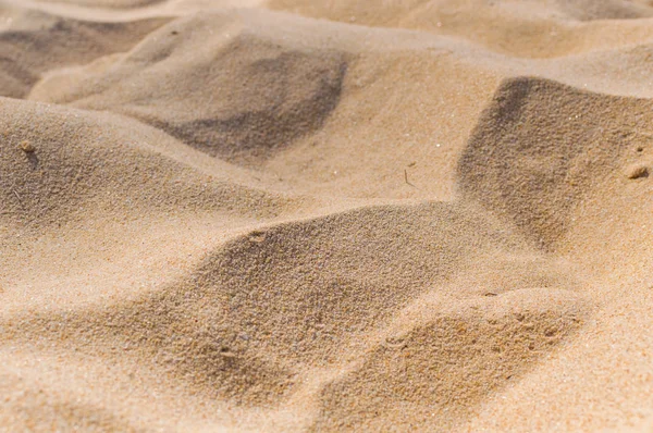 Areia na textura de fundo da praia — Fotografia de Stock