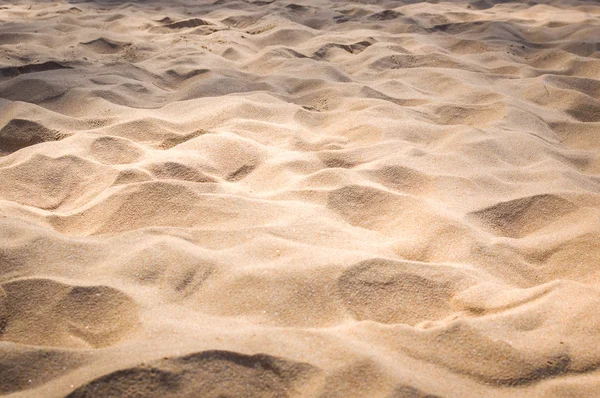 Areia na textura de fundo da praia — Fotografia de Stock