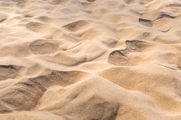 Areia na textura de fundo da praia — Fotografia de Stock