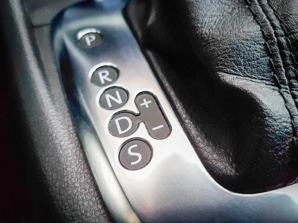 Icon near a floor selection lever of car with automatic transmis