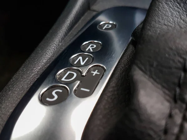 Icon near a floor selection lever of car with automatic transmis