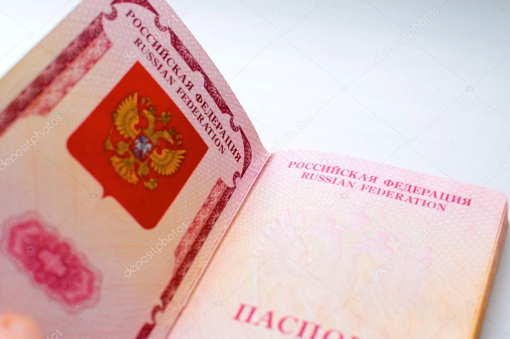 Open on first page Russian passport on white background