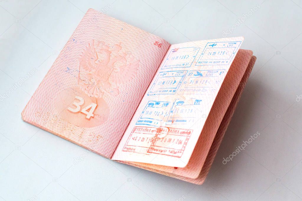 Russian passport stamped on border crossing. Departure and arrival immigration stamps.