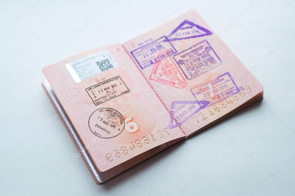 Russian passport stamped on border crossing. Departure and arrival immigration stamps.
