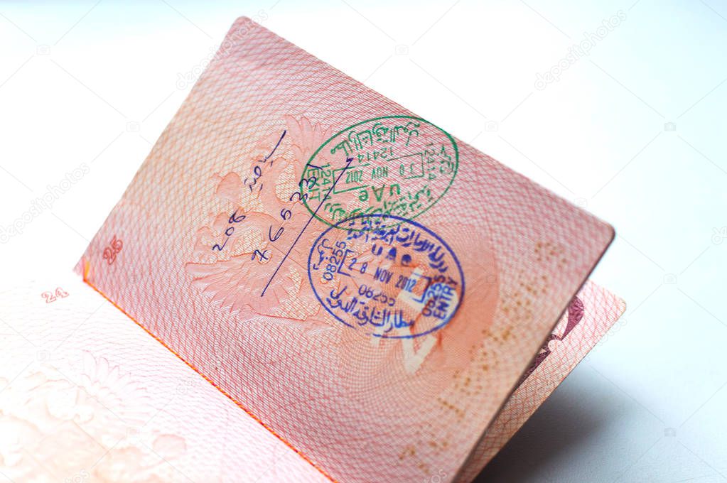 Russian passport stamped on border crossing. Departure and arrival immigration stamps.