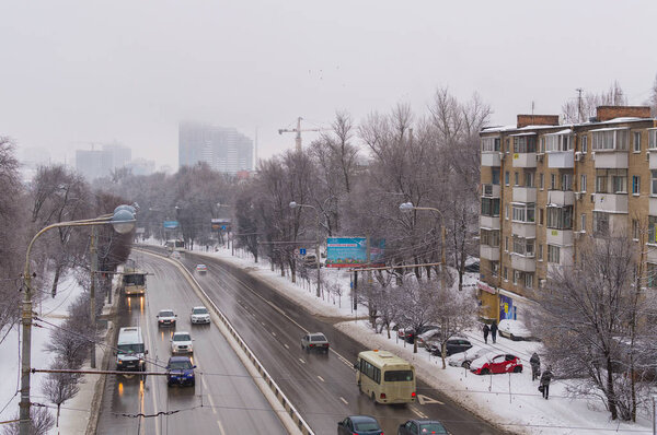 Russia, Rostov on Don, February 13, 2018: Road traffic in snowfall time at street in the city.