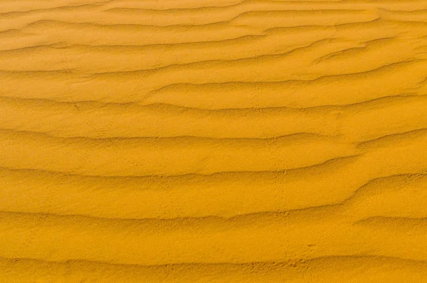 Textura de areia amarela para fundo — Fotografia de Stock