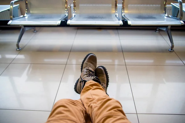 Man Sitting His Legs Hiking Boots Floor Airport Parking Lot — Stock Photo, Image