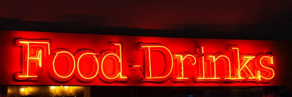 Red neon sign title Food and Drinks.