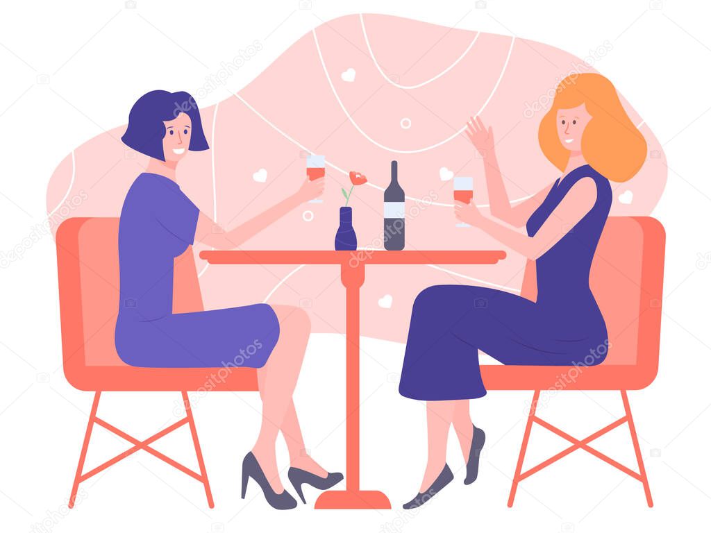 Couple of girls sitting at a table in a restaurant