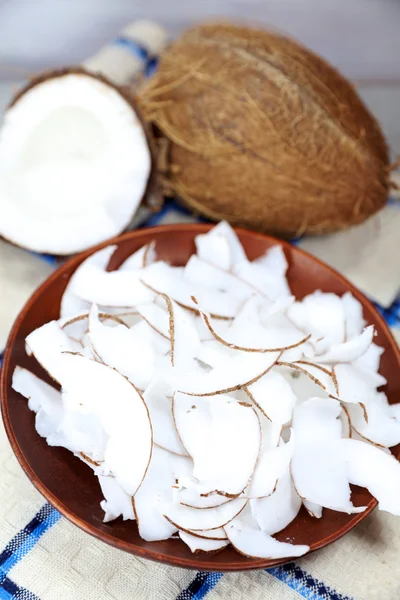 exotic food option, fresh coconut chips in a plate