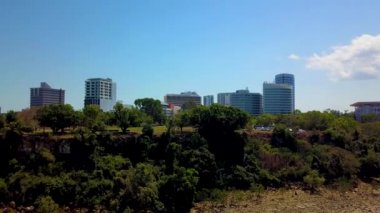 Aerial reveal, Darwin city on a clear sunny tropical day in the dry season. Australia.