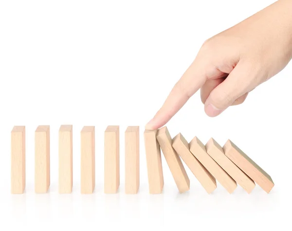 Hand stop domino ciągłe obalanie — Zdjęcie stockowe