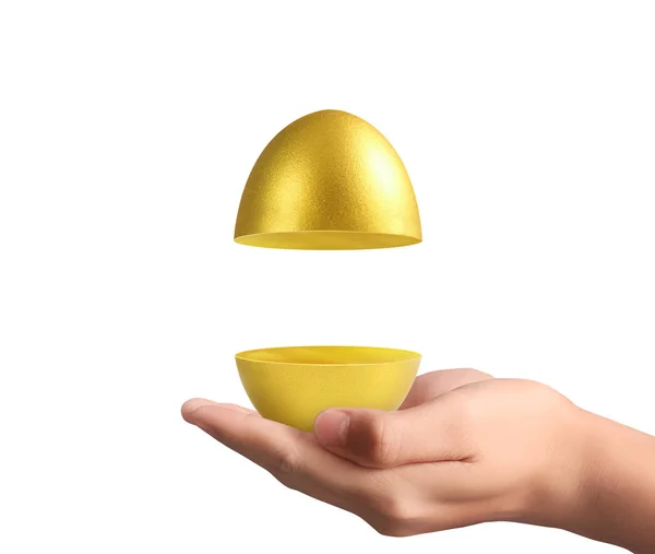 Hand Holding uova d'oro — Foto Stock