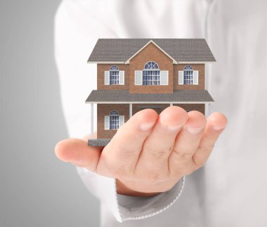 ev sahipliği temsil eden holding evi 