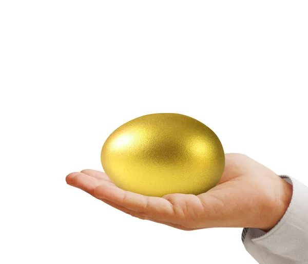 Hand hält goldene Eier — Stockfoto