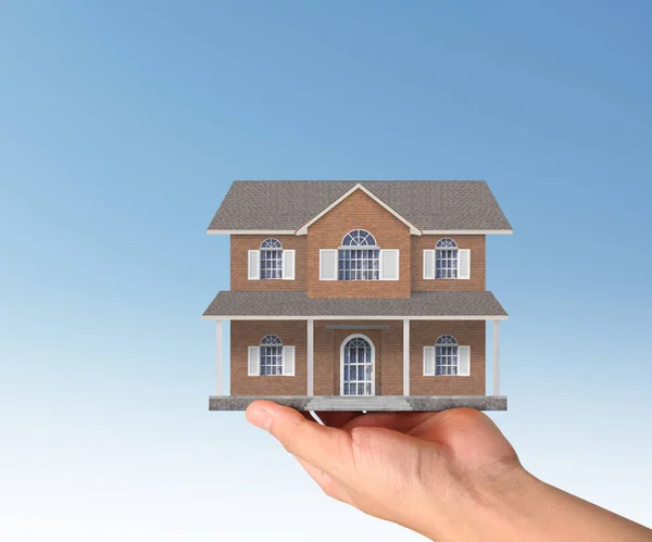 Концепция ипотеки по дому из рук — стоковое фото