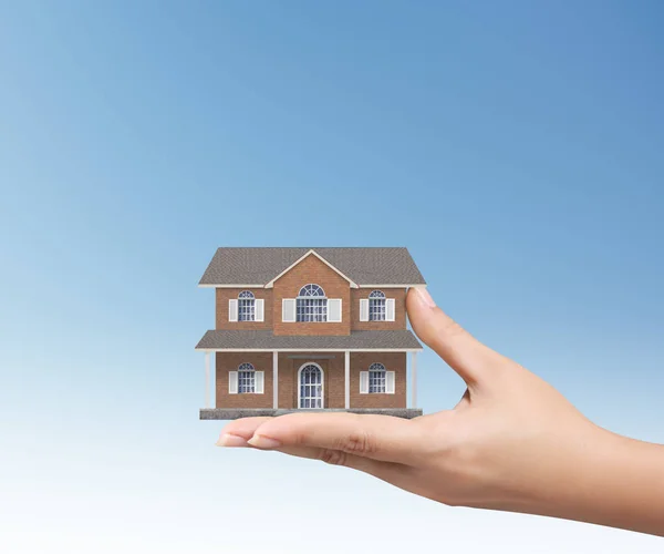 Concepto de hipoteca por casa desde en la mano —  Fotos de Stock