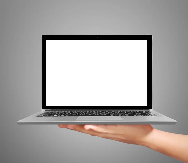 Hand holding a laptop — Stockfoto