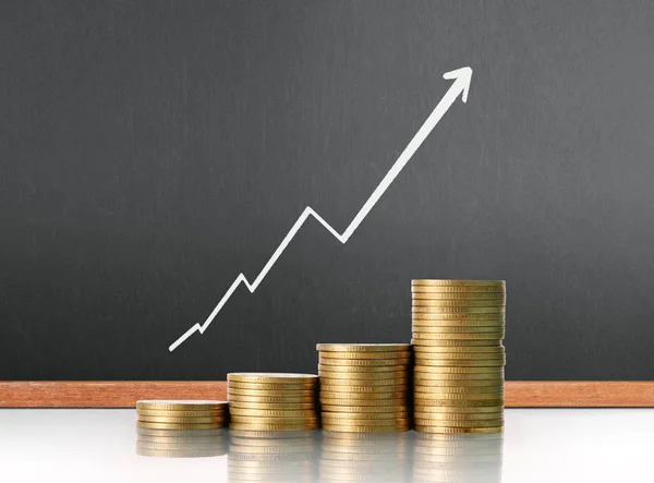 Coins graph stock market — Stock Photo, Image