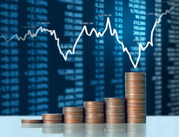 Coins graph stock market — Stock Photo, Image