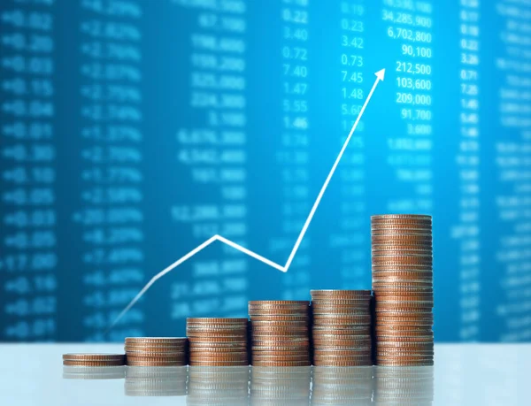 Coins graph stock market — Stock Photo, Image
