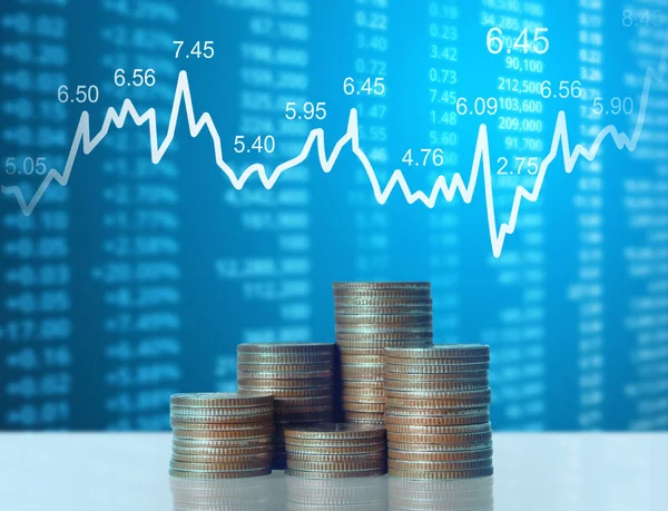 Coins graph stock market — Stock Photo, Image