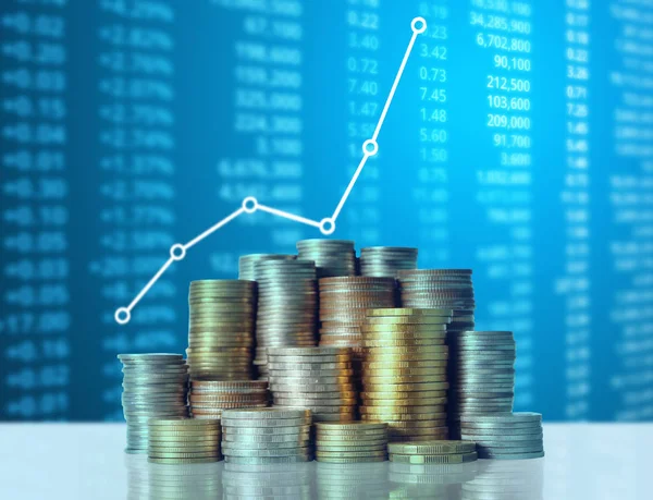 Coins graph stock market — Stock Photo, Image