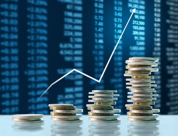 Coins graph stock market — Stock Photo, Image