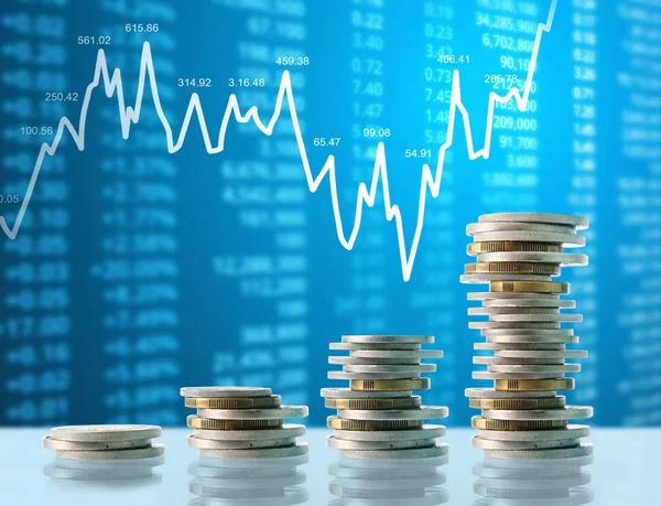 Coins graph stock market — Stock Photo, Image