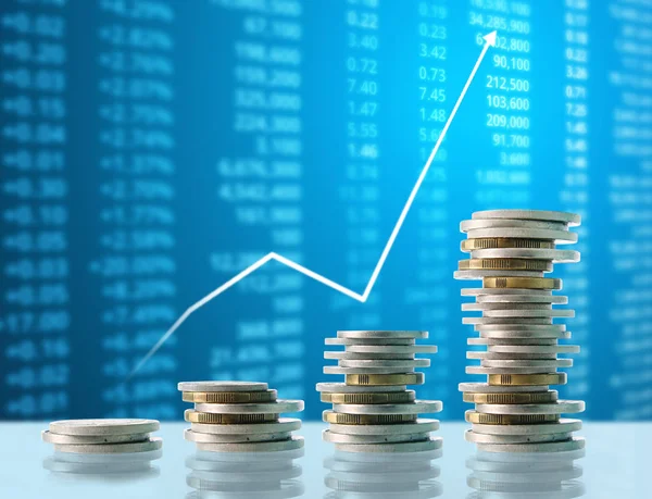 Coins graph stock market — Stock Photo, Image