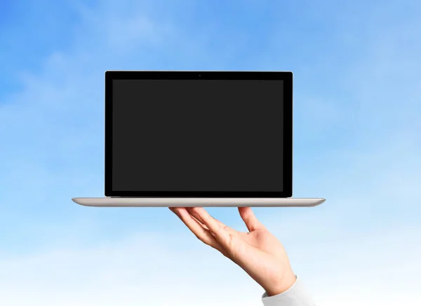 Male hand holding  laptop — Stock Photo, Image