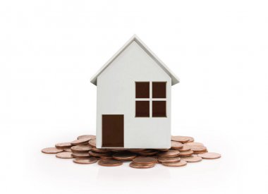 Sikke yığını üzerinde duran küçük ev