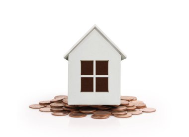 Sikke yığını üzerinde duran küçük ev