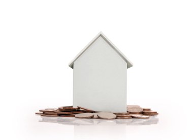 Sikke yığını üzerinde duran küçük ev