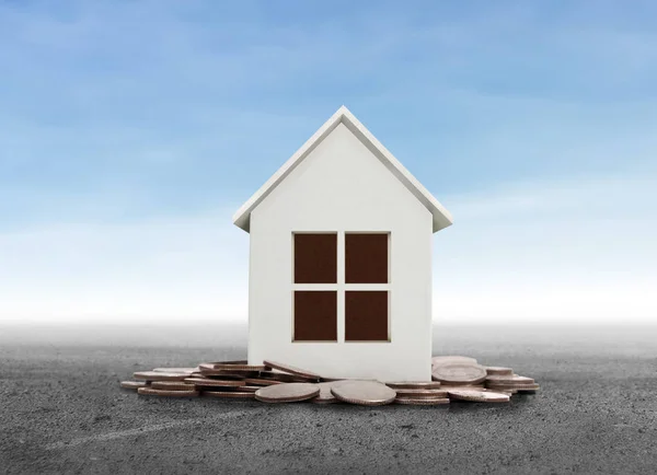 Small house standing on stacks  coins — Stock Photo, Image