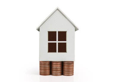 Sikke yığını üzerinde duran küçük ev