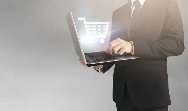 Business man and suit holding laptop in hands — Stock Photo, Image