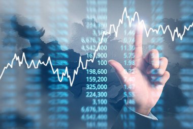 Bir ekrandaki resimli grafikler borsa finansal verileri analiz ediliyor