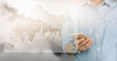 Bir ekrandaki resimli grafikler borsa finansal verileri analiz ediliyor