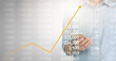 Bir ekrandaki resimli grafikler borsa finansal verileri analiz ediliyor