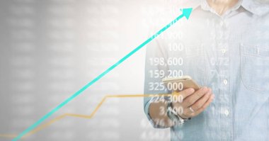 Bir ekrandaki resimli grafikler borsa finansal verileri analiz ediliyor