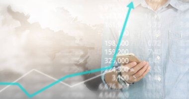 Bir ekrandaki resimli grafikler borsa finansal verileri analiz ediliyor