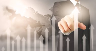 Bir ekrandaki resimli grafikler borsa finansal verileri analiz ediliyor