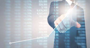 Bir ekrandaki resimli grafikler borsa finansal verileri analiz ediliyor